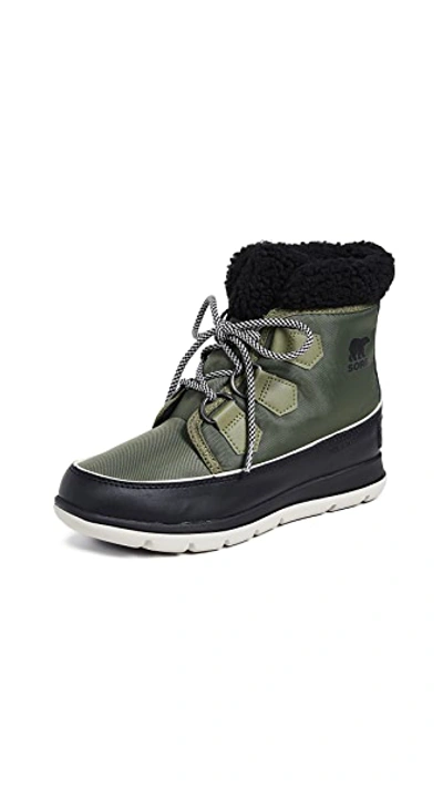 Shop Sorel Explorer Carnival Boots In Hiker Green/black