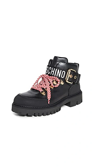 Shop Moschino Combat Ankle Boots In Black/black