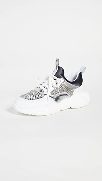 Shop Moschino Stone Embellished Sneakers In Grey/white/silver/grey