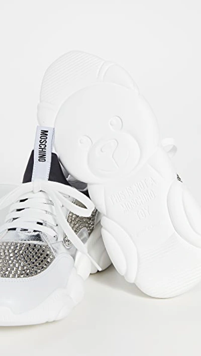 Shop Moschino Stone Embellished Sneakers In Grey/white/silver/grey