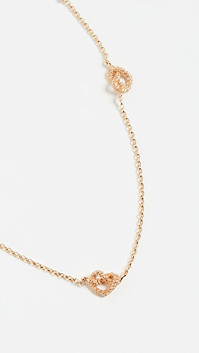 Shop Kate Spade Loves Me Knot Pave Necklace In Clear/gold