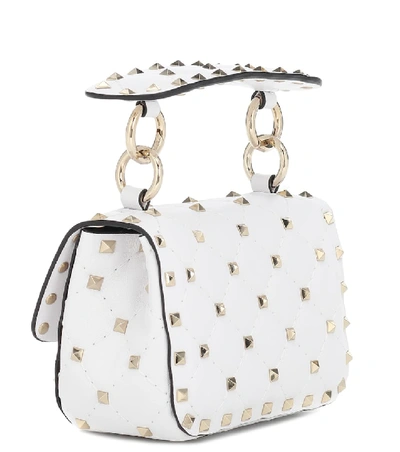 Shop Valentino Rockstud Spike Micro Leather Crossbody Bag In White