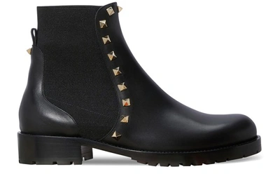 Shop Valentino Gavarani Studded Flat Ankle Boots In Black
