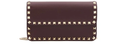 Shop Valentino Garavani Rockstud Pouch In Rubin