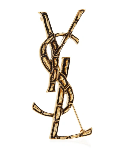 Shop Saint Laurent Crocodile Textured Ysl Brooch In Gold