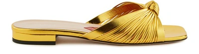 Shop Gucci Knot Mules In Gold