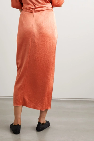 Shop Nanushka Samara Twist-front Washed-satin Midi Skirt In Pastel Orange