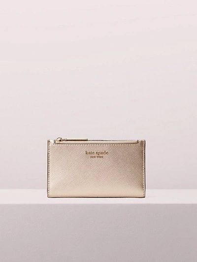 Shop Kate Spade Spencer Small Slim Bifold Wallet In Rose Gold