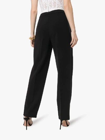 Shop Moschino Face Embroidered Tailored Trousers In Black