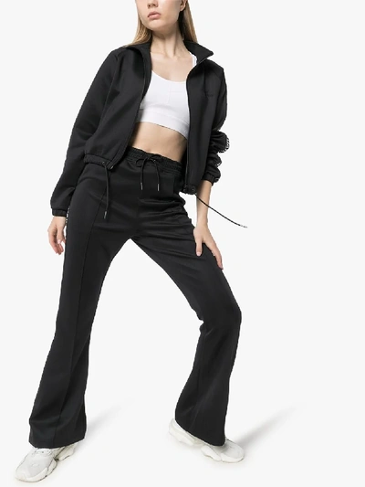 Shop Daily Paper Tape Logo Flared Track Pants In Black