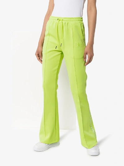 Shop Daily Paper Tape Logo Flared Track Pants In Green