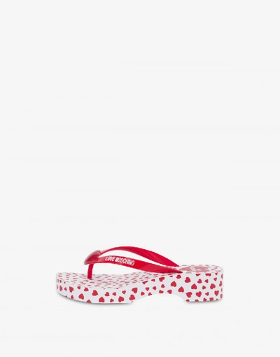 Shop Love Moschino Flip Flop Sandals With All Over Hearts In Red