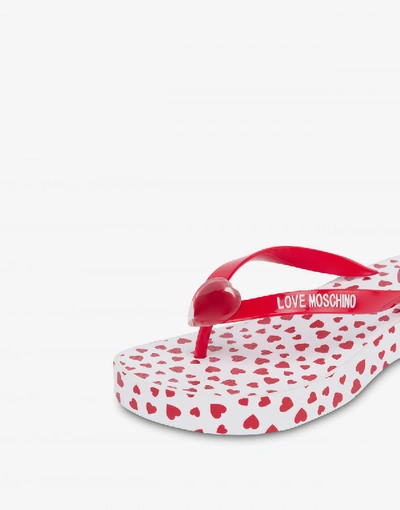 Shop Love Moschino Flip Flop Sandals With All Over Hearts In Red