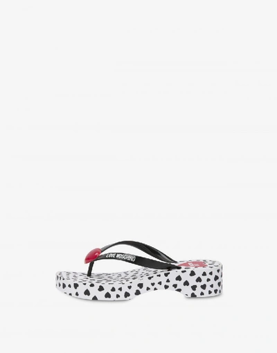 Shop Love Moschino Flip Flop Sandals With All Over Hearts In Red