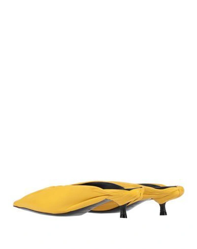 Shop Balenciaga Mules In Yellow