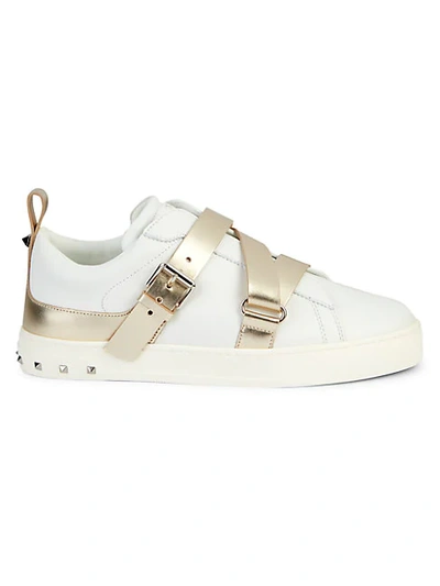 Shop Valentino Buckle Strap Rockstud Leather Sneakers In Bianco