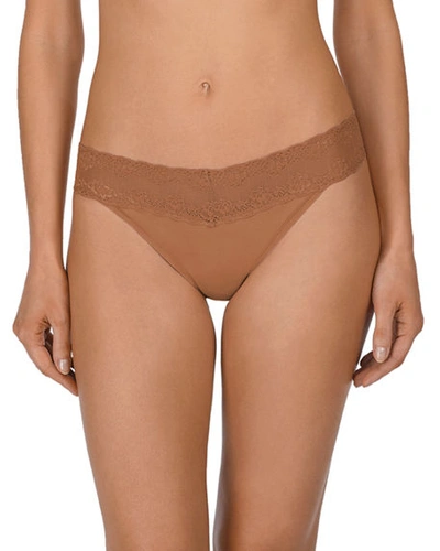 Shop Natori Bliss Perfection Lace-trimmed Thong (one Size) In Glow
