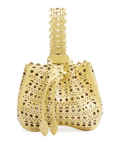 Shop Alaïa Rose-marie Small Bucket Bag In Yellow