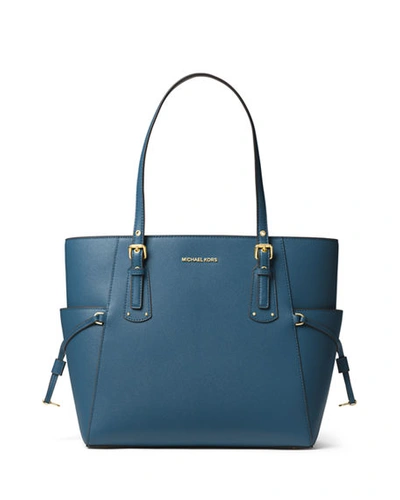 Shop Michael Michael Kors Voyager E/w Signature Saffiano Tote Bag - Golden Hardware In Blue