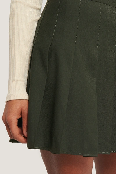 Shop Romy X Na-kd Pleated Short Skirt - Green In Dark Green