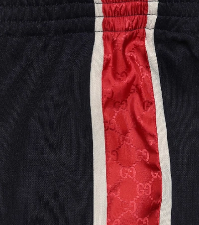 Shop Gucci Gg Stripe Jersey Trackpants In Blue