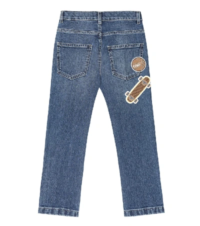 Shop Fendi Appliqué Stretch-denim Jeans In Blue