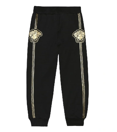 Shop Versace Printed Cotton Trackpants In Black