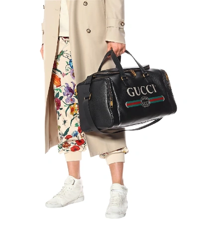 Shop Gucci Print Leather Travel Bag In Black