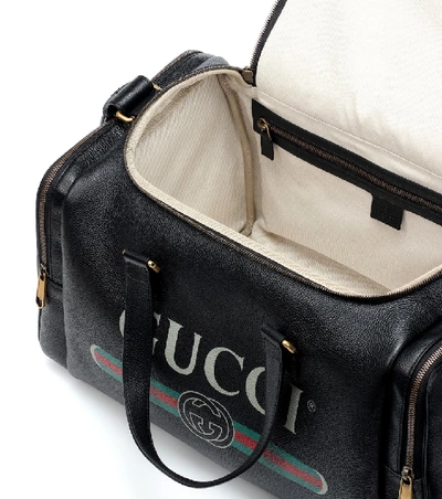 Shop Gucci Print Leather Travel Bag In Black