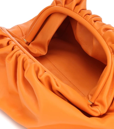 Shop Bottega Veneta Pouch Leather Clutch In Orange
