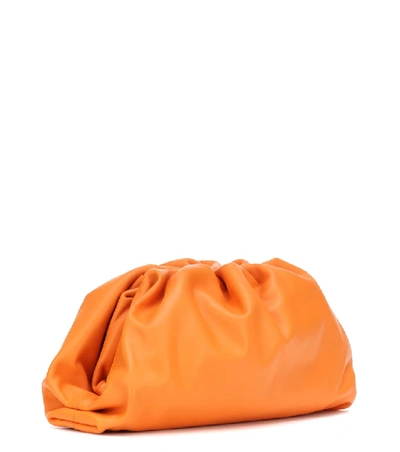 Shop Bottega Veneta Pouch Leather Clutch In Orange