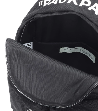 Shop Off-white Quote Printed Canvas Backpack In Black