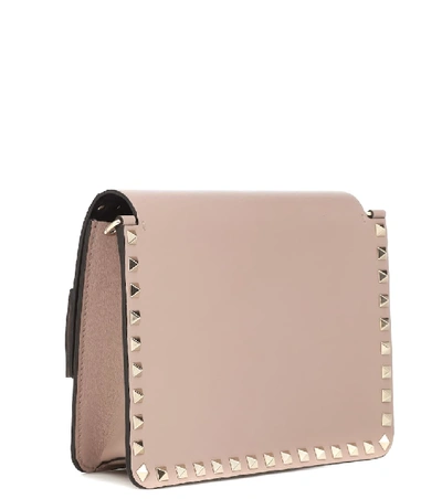 Shop Valentino Rockstud Small Crossbody Bag In Neutrals