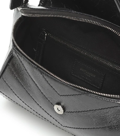 Shop Saint Laurent Niki Crinkled-leather Belt Bag In Black