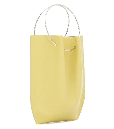 Shop The Row Flat Micro Circle Leather Tote In Yellow