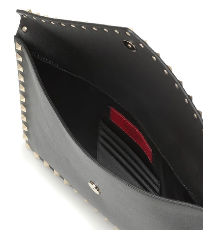 Shop Valentino Rockstud Large Leather Clutch In Black