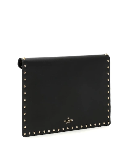 Shop Valentino Rockstud Large Leather Clutch In Black