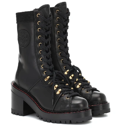 Shop Versace V-alpine Leather Ankle Boots In Black