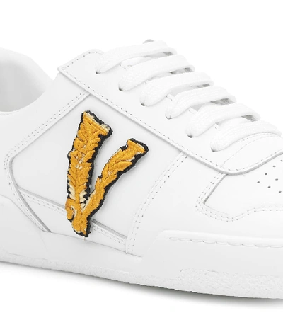 Shop Versace Ilus Virtus Leather Sneakers In White
