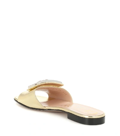 Shop Gucci Metallic Leather Slides In Gold