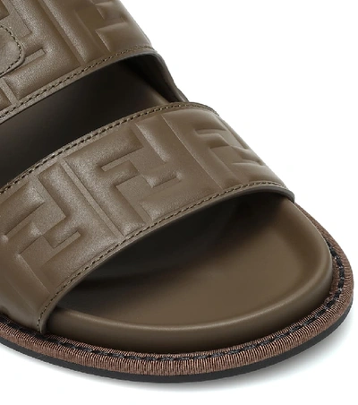 Shop Fendi Ff Embossed Leather Sandals In Brown