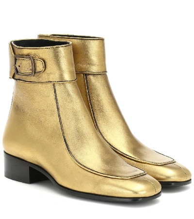 Shop Saint Laurent Miles Leather Ankle Boots In Gold