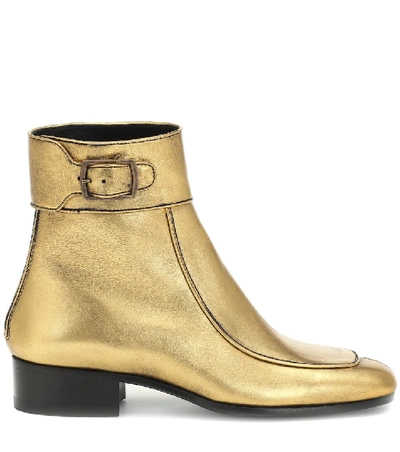 Shop Saint Laurent Miles Leather Ankle Boots In Gold