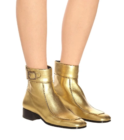 Shop Saint Laurent Miles Leather Ankle Boots In Gold