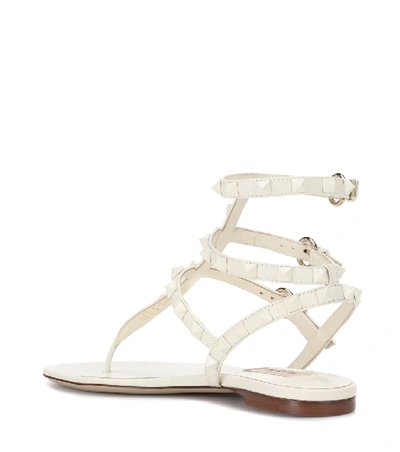 Shop Valentino Rockstud Leather Sandals In White