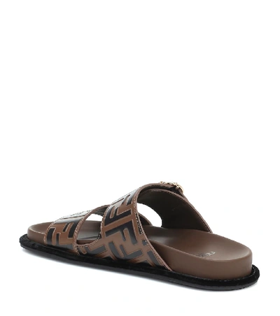 Shop Fendi Ff Embossed Leather Sandals In Brown