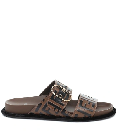 Shop Fendi Ff Embossed Leather Sandals In Brown