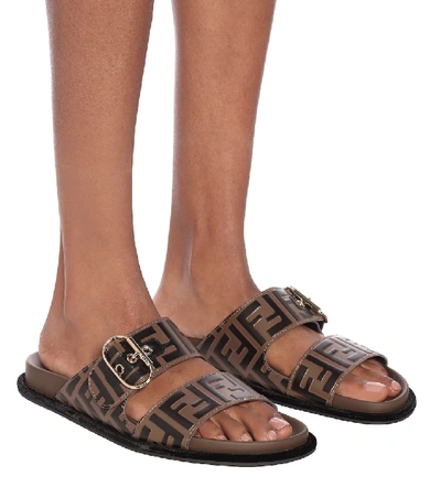 Shop Fendi Ff Embossed Leather Sandals In Brown