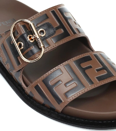 Shop Fendi Ff Embossed Leather Sandals In Brown