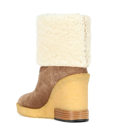 Shop Tod's Suede Wedge Ankle Boots In Beige